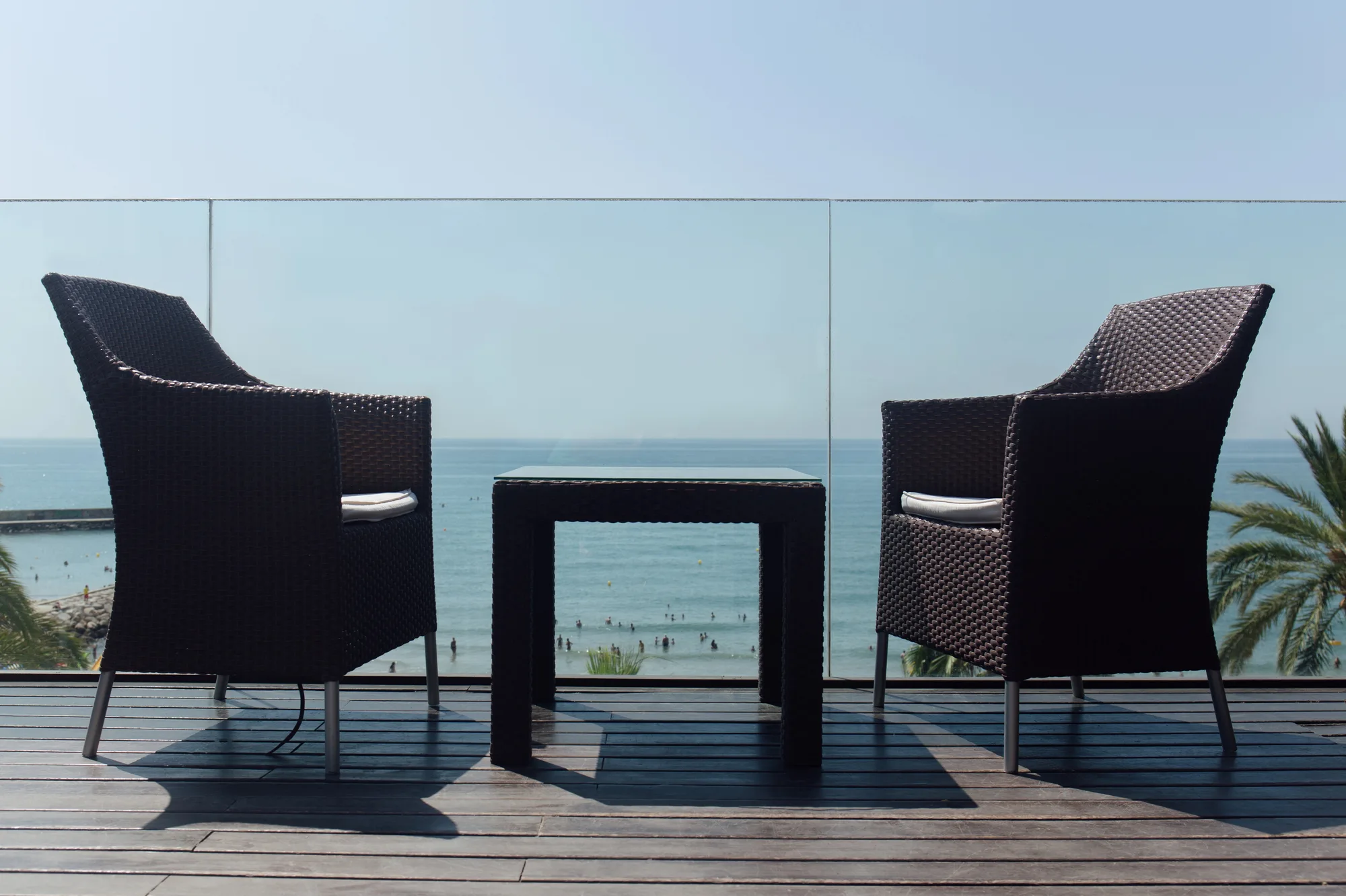 Glass balustrade on a balcony overlooking the ocean