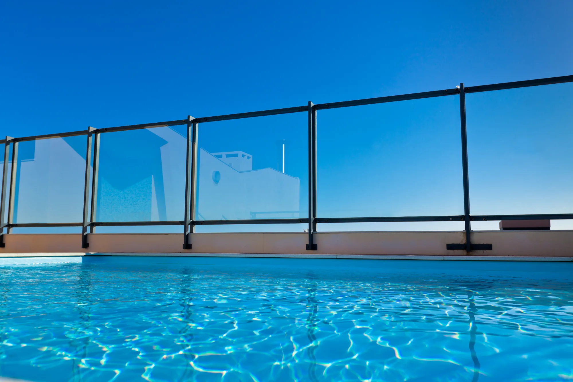 Glass pool fencing around a rooftop pool in Townsville